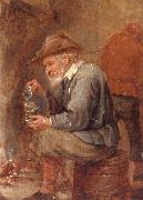 An old man sitting by the fire,pouring with into a roemer